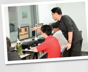 Instructor guiding a learner during a technical lesson